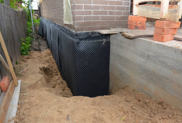 SJ Waterproofing Pros technician performing targeted Basement Waterproofing assessment in Danville, AL